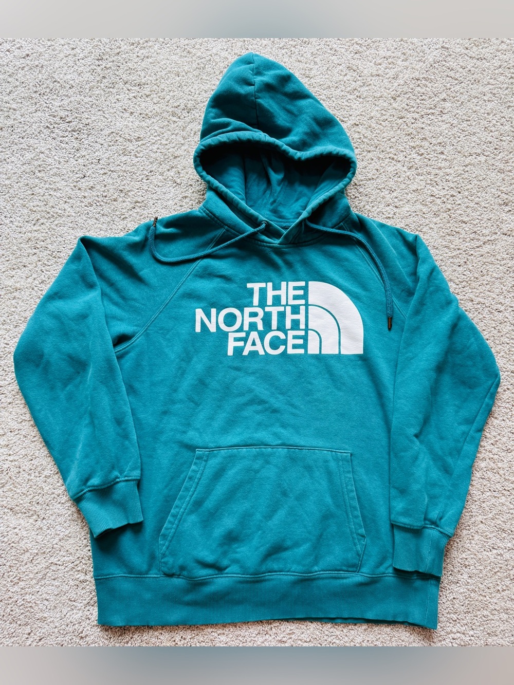 The North Face Teal Hoodie size women’s medium.